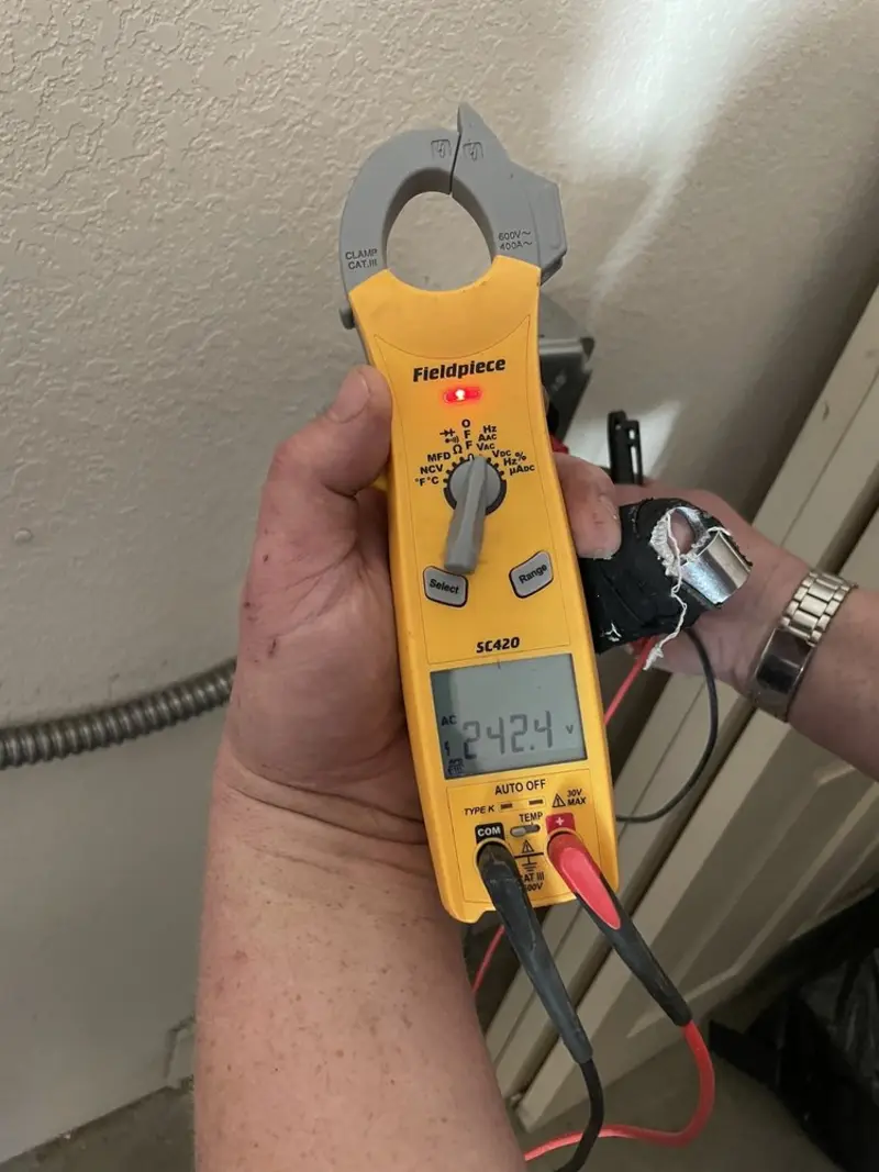 Voltage testing with clamp meter during Electrical Installation Services in Belmar